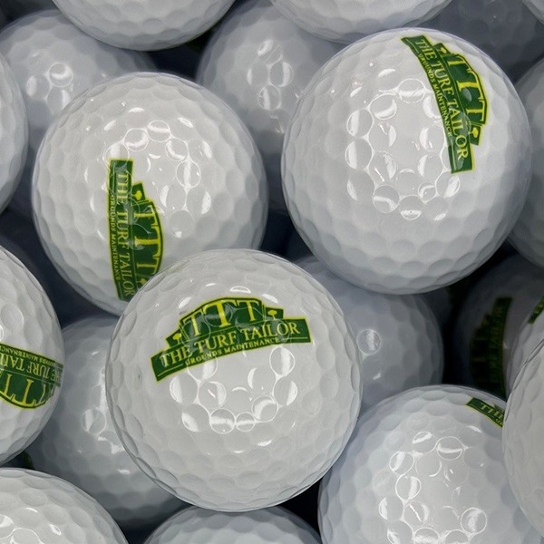 Custom logo golf balls featuring a green and yellow printed design