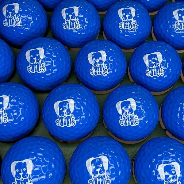 Blue custom golf balls printed with a white dog design