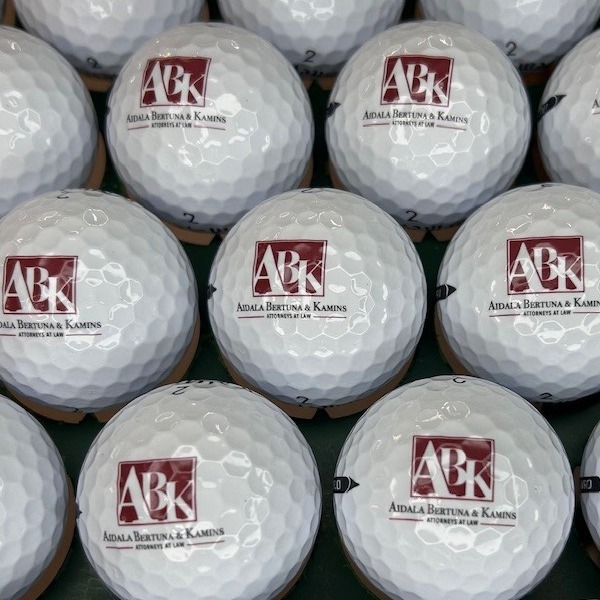 Logo golf balls printed with burgundy company branding