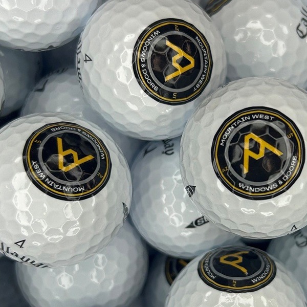 Custom logo golf balls featuring black and gold circular designs
