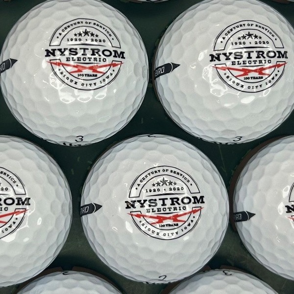 Custom logo golf balls featuring a black and red circular design