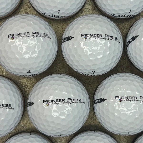 Custom golf balls printed with a black company logo