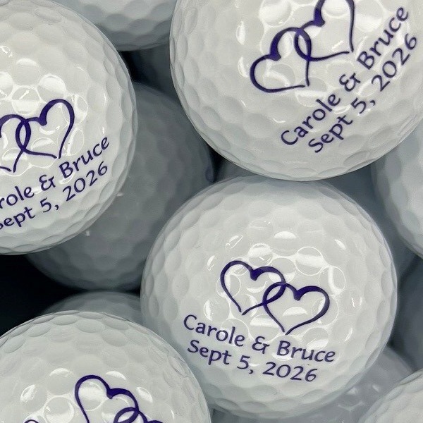 Personalized wedding golf balls printed with names, hearts and a wedding date