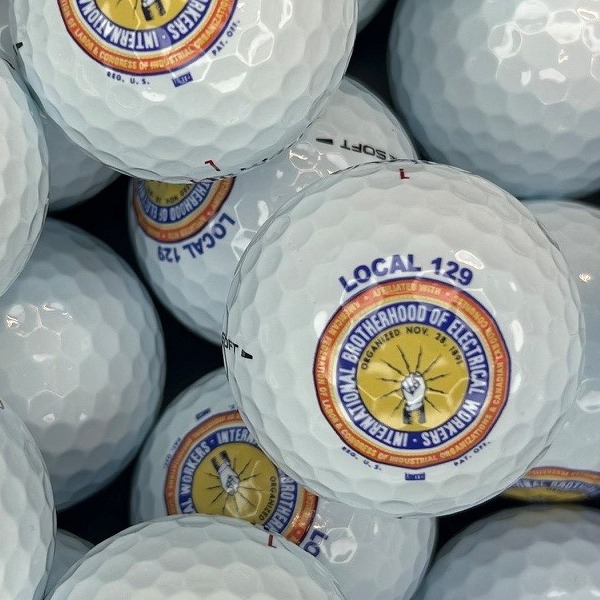 Custom golf balls printed with a colorful organization emblem