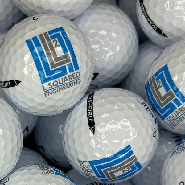 Custom logo golf balls featuring a blue geometric company design