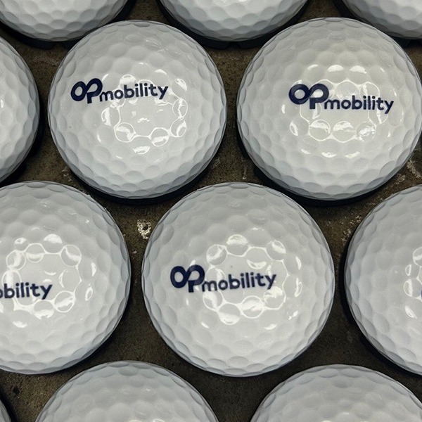 White custom logo golf balls printed with a blue company logo