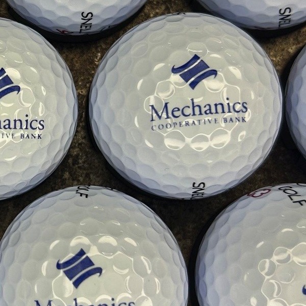 Snell golf balls custom printed with a blue bank logo
