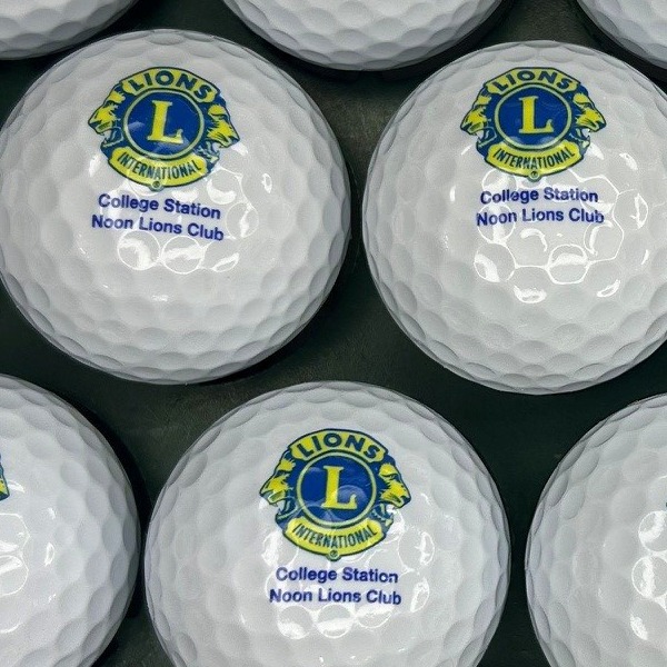 White logo golf balls printed with a service club emblem