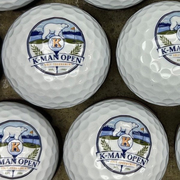 Custom golf balls printed with a full-color golf tournament logo