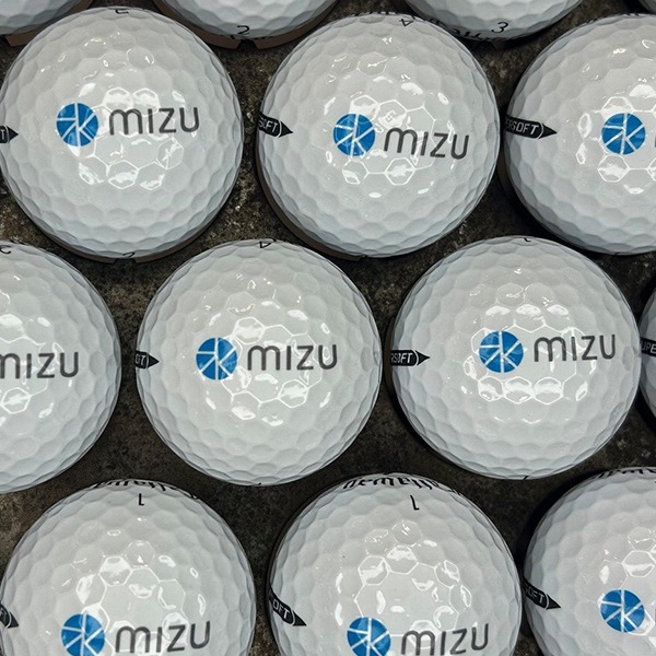 White custom golf balls printed with a blue company logo