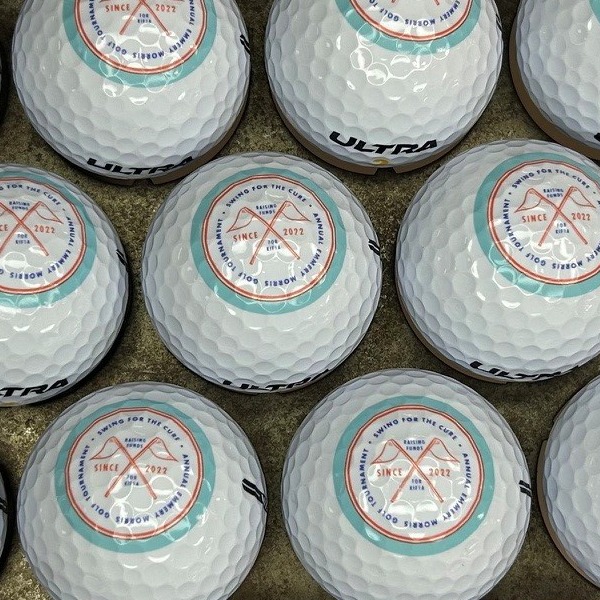 Wilson Ultra golf balls printed with a full-color circular event logo