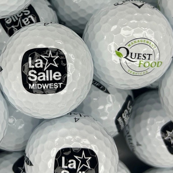 Callaway golf balls printed with assorted black and green company logos