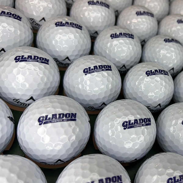 Logo golf balls printed with custom blue company branding
