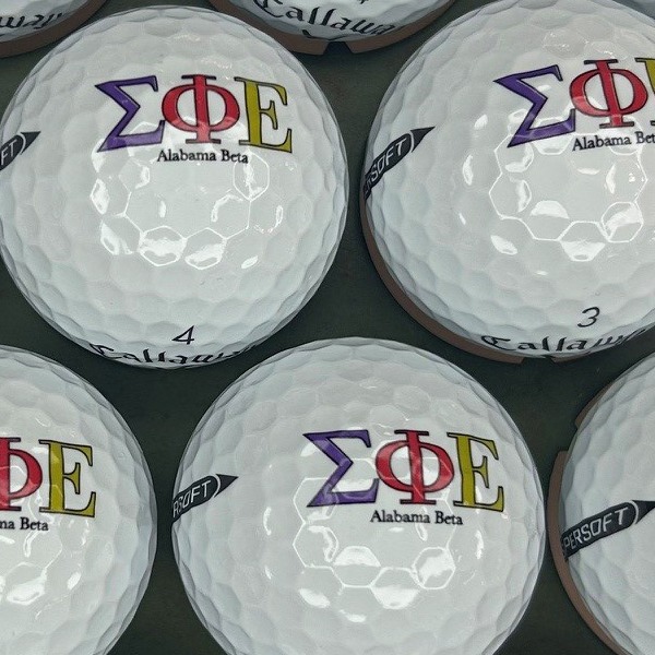Callaway golf balls printed with purple and gold Greek letters