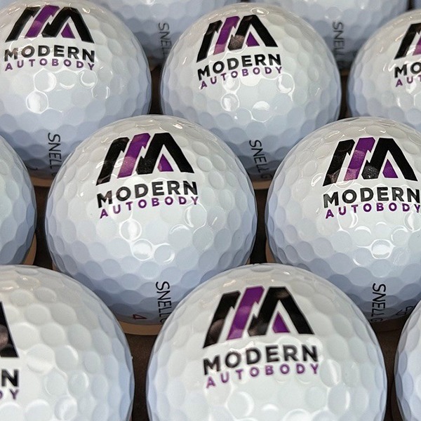 Custom logo golf balls featuring a full-color printed design