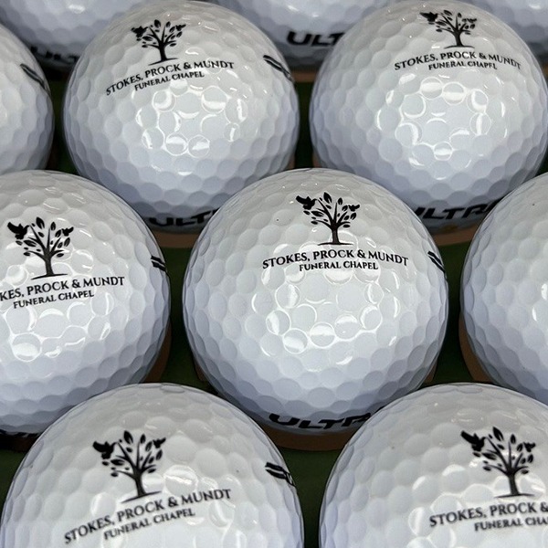 Custom golf balls printed with a detailed black logo
