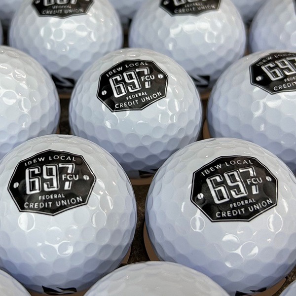 Logo golf balls featuring a custom black and white design