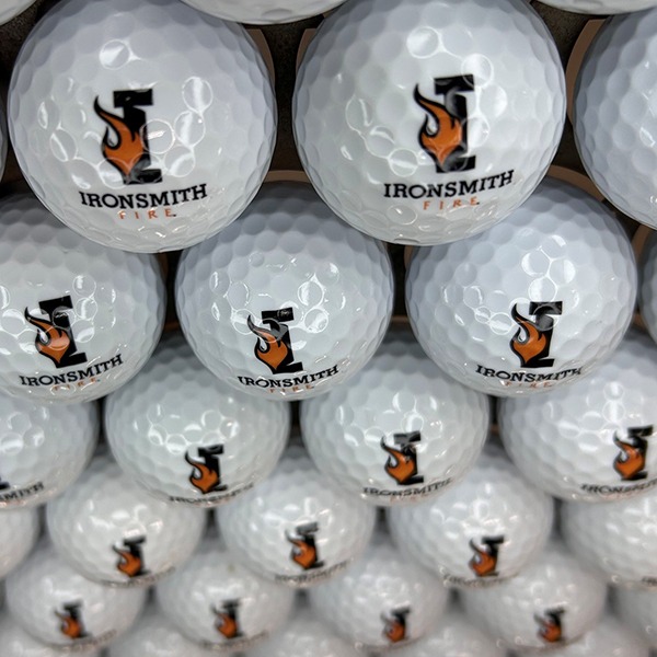 Custom logo golf balls with orange and black printed artwork
