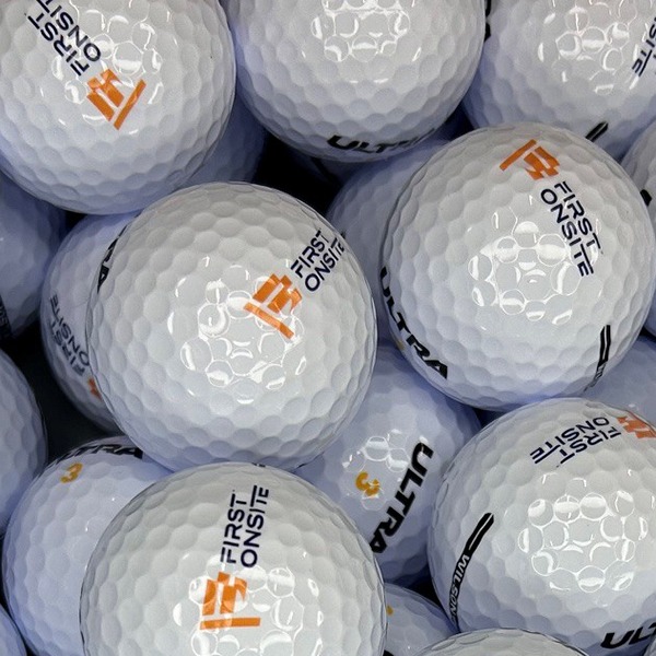 Logo golf balls printed with custom orange and black branding