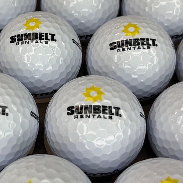 Logo golf balls featuring a custom black and yellow company design