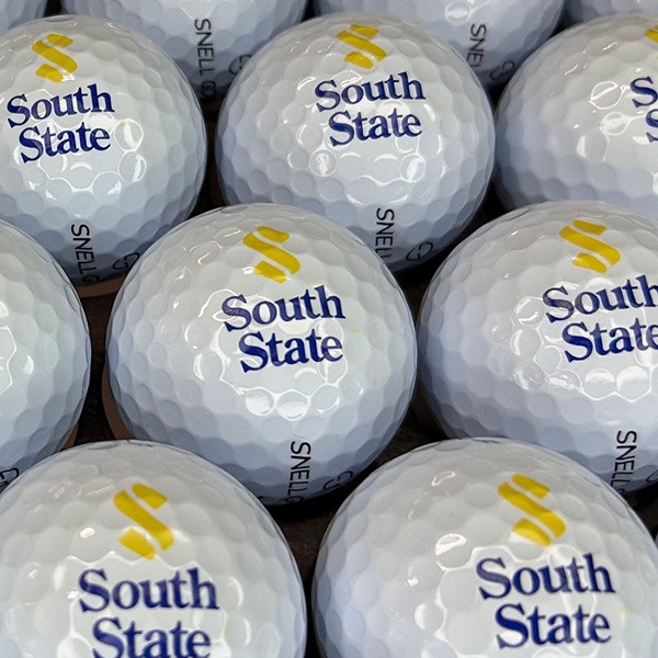 Custom golf balls printed with a full-color company logo