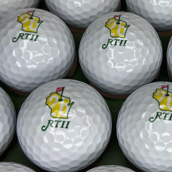 Custom tournament golf balls printed with a full-color event logo
