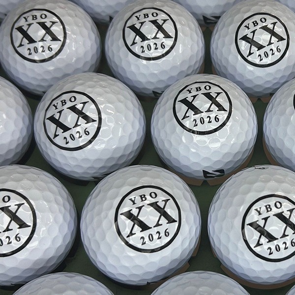 Personalized golf balls printed with a custom 2026 event design