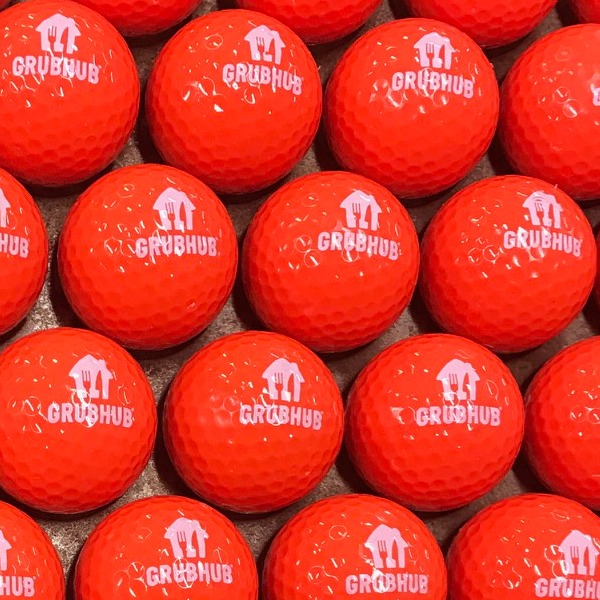 Red custom golf balls printed with a white corporate logo
