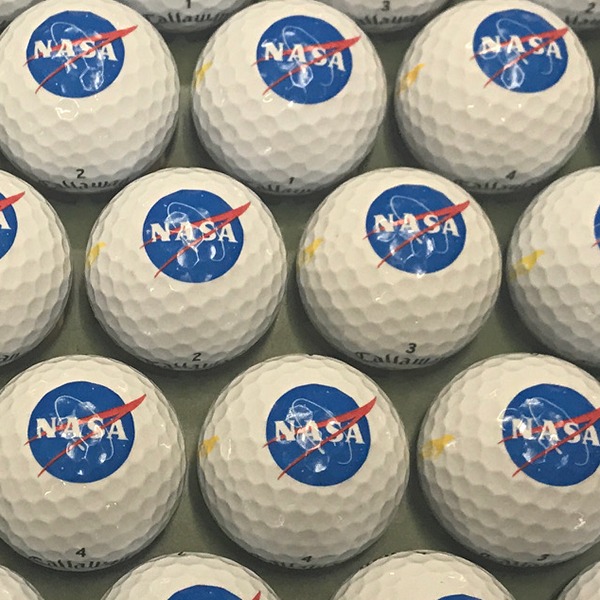 Custom golf balls printed with a full-color space-themed logo