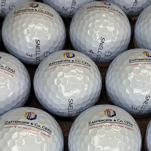 Custom logo golf balls with a detailed multicolor printed design