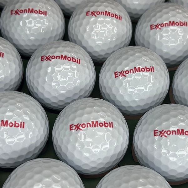 Custom golf balls featuring a red corporate logo
