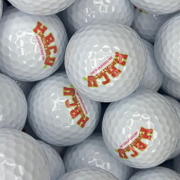 Logo golf balls printed with a custom red and yellow design