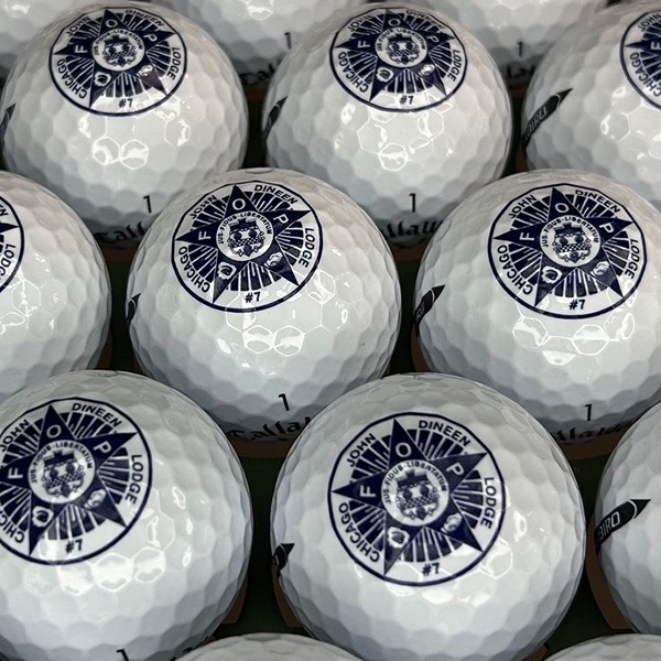 Logo golf balls featuring a detailed blue circular design