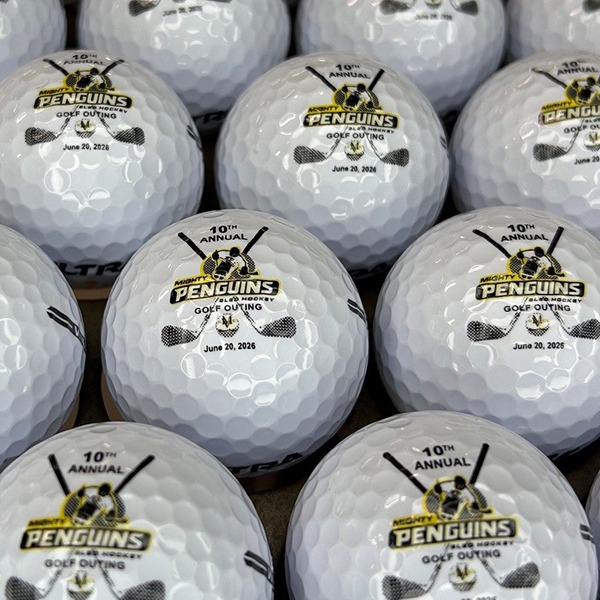 Personalized golf balls commemorating a 10th annual golf event