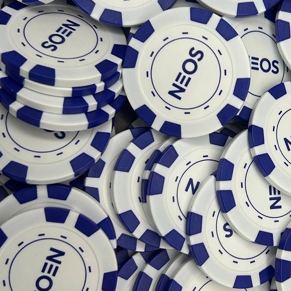 Blue and white personalized poker chips featuring company logos