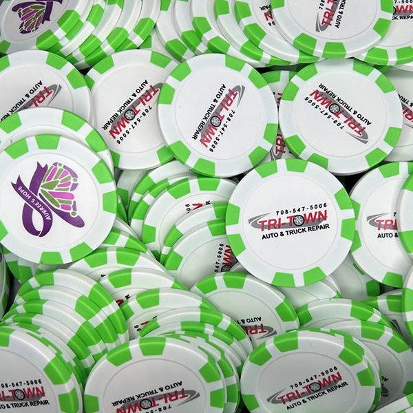 Green personalized poker chips featuring full-color custom logos