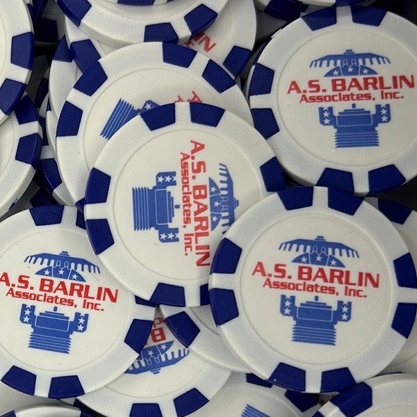Navy and white custom poker chips printed with a red and blue company logo
