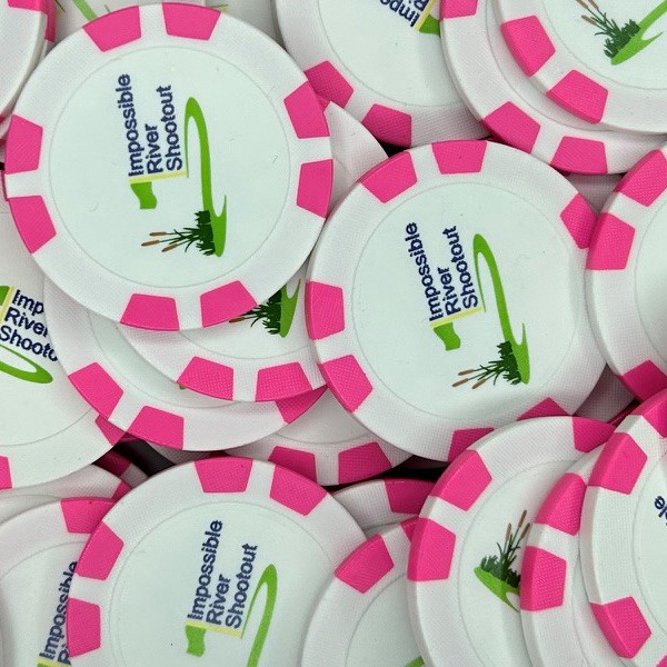 Pink and white custom poker chips printed for a golf shootout event