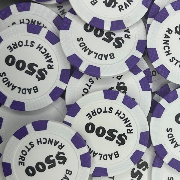 Purple custom poker chips printed with personalized dollar values