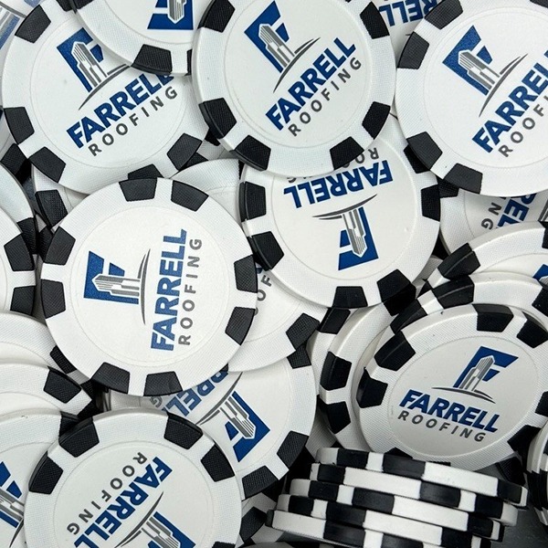Black and white promotional poker chips printed with a blue company logo