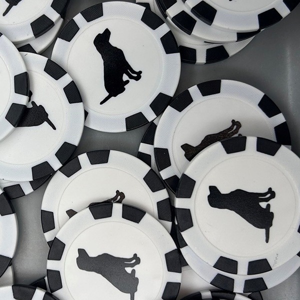 Black and white custom poker chips featuring an animal silhouette design