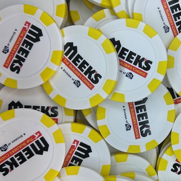 Yellow promotional poker chips printed with red and black company branding