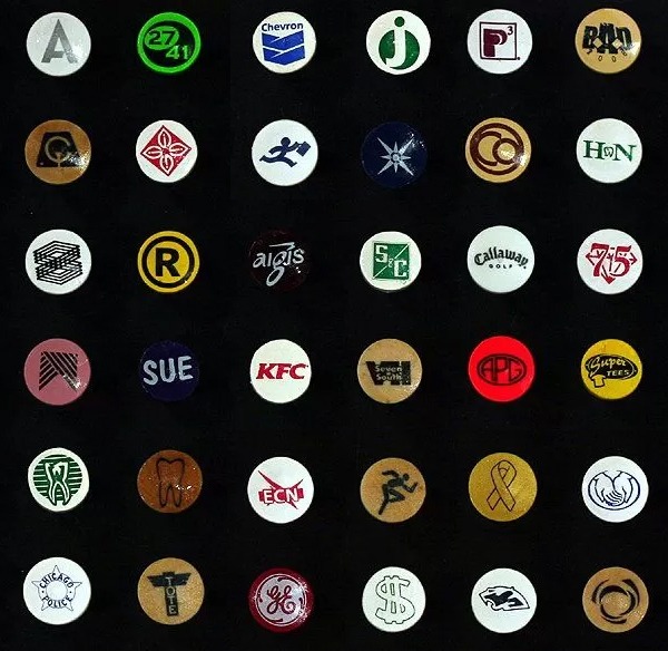 Logo golf tees featuring a variety of custom cup imprint designs